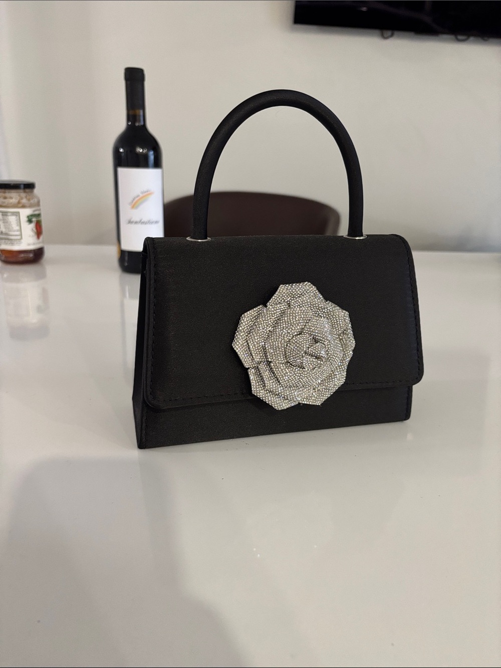 Elegant Black Top-Handle Bag with Crystal Flower Accent